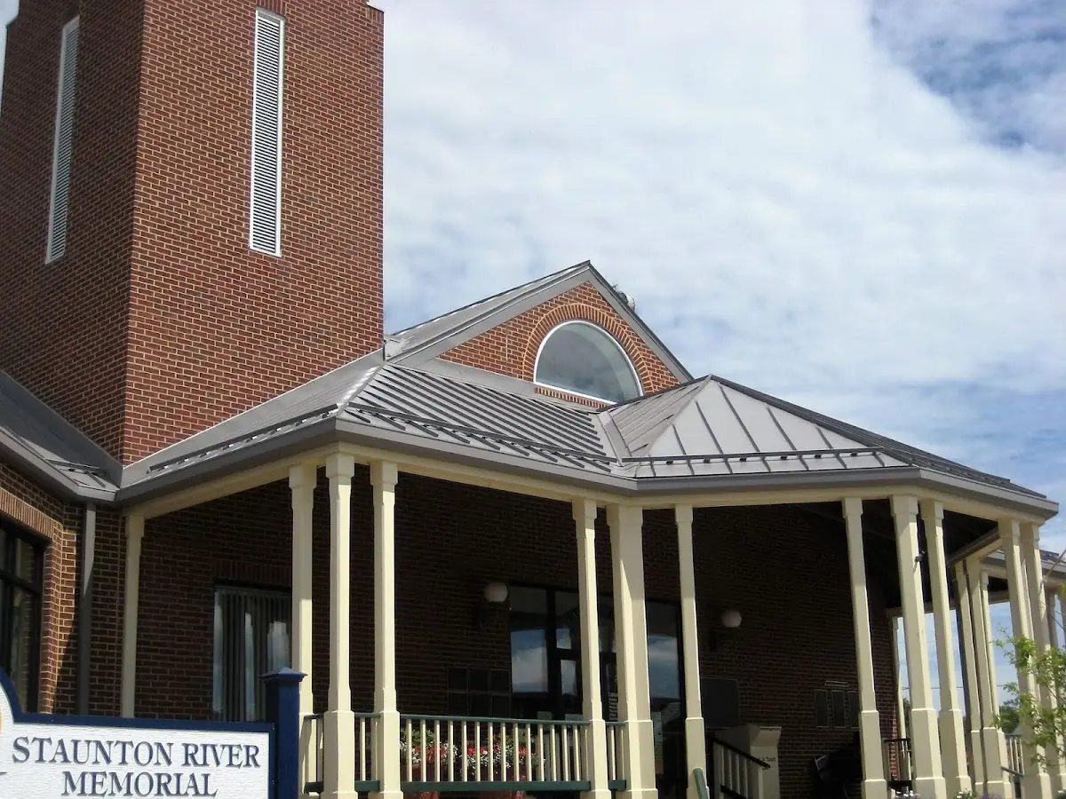Skilled roofing craftsmen working on a residential roof in Muttonville